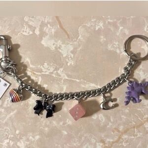 Coach Silver-Tone Charm Bracelet with Purple Dinosaur & Pink Dice